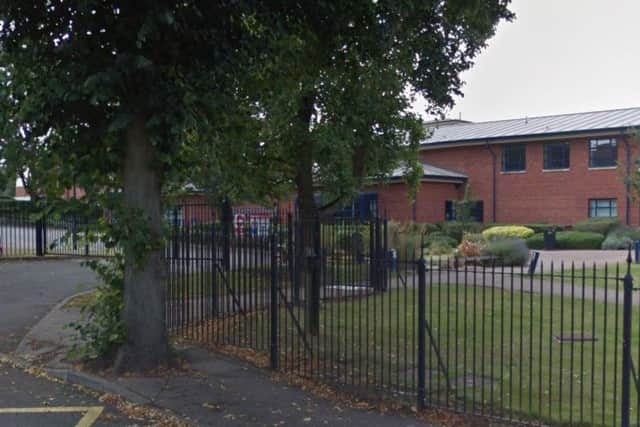 The suspect was seen in a car outside Malcolm Arnold Academy.
