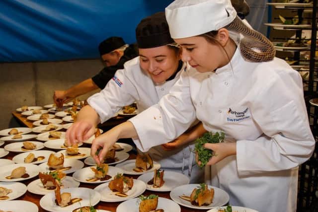 Northampton College students help out in the kitchen.