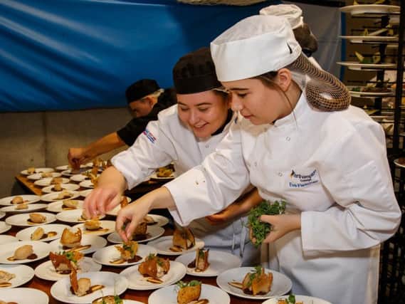 Northampton College students help out in the kitchen.