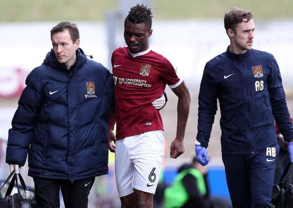 FINAL APPEARANCE - Gaby Zakuani leaves the Sixfields pitch after damaging his hamstring in the win over Charlton on March 4