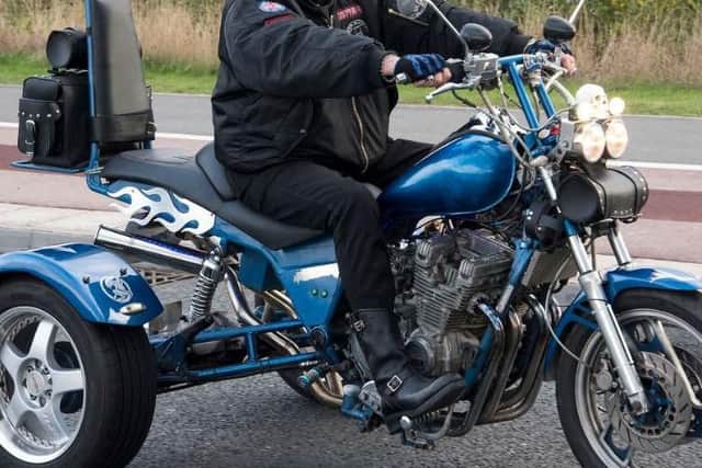 A motorcyclist.
