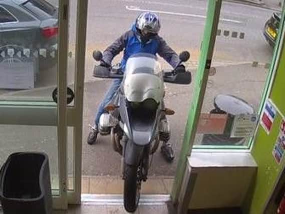 The robber attempted to drive into the Co-Op supermarket in Duston on his motorbike.