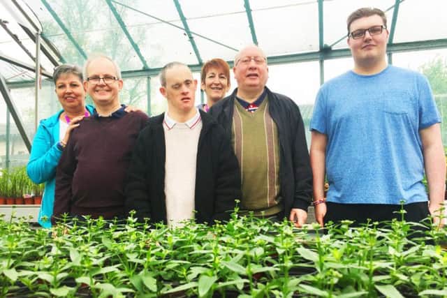 A group of adults is spending a day a week on campus for six weeks, shadowing the ground staff team and offering a helping hand.