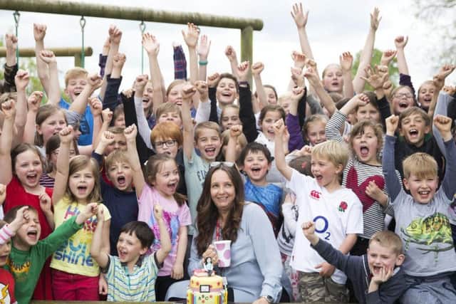Pupils of East Haddon CoE Primary School crowded around Claire in support of her hard work over the last 25 years.