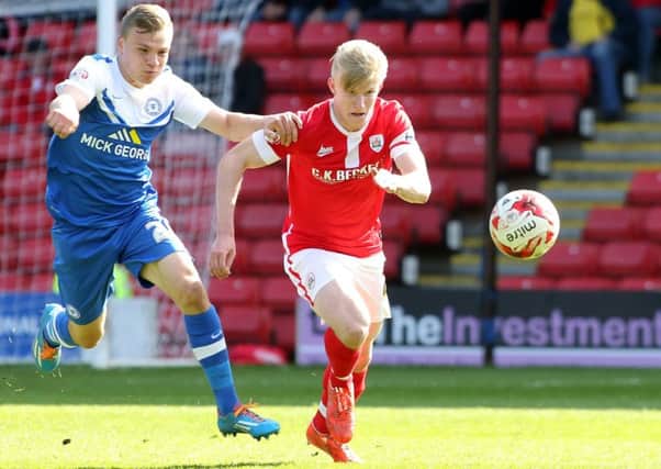 George Smith (right) in action for Barnsley against Peterborough United