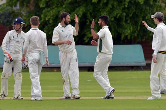 Saints celebrate a wicket in their defeat to Old Northamptonians (Pictures: Dave Ikin)