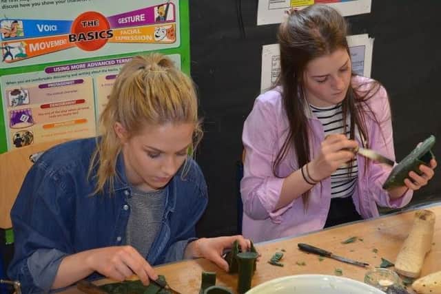Quinton House School students design their shoes out of wax. Photo credit: Eleanor Mesquita