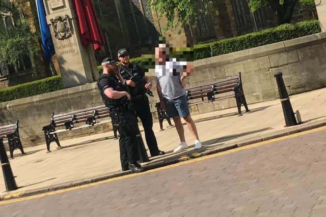 Armed officers by the town's cenotaph this morning.