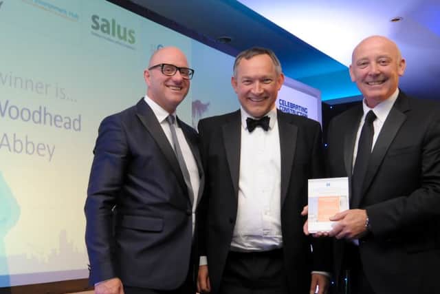 Craig Pygall and Paul Haythorne of Robert Woodhead Ltd accept the Preservation and Rejuvenation Award