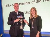 Ashley Liggins receives her award from Chief Constable Simon Edens
