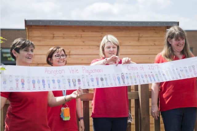 A banner with every child drawn on it made by a member of staff was rolled up and placed in the capsule.