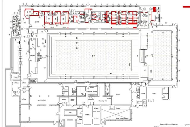 The lines in red mark where walls will be knocked down.