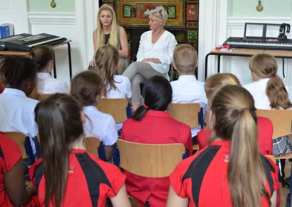 Amber Owen and her mother Samantha Miles talk to year seven pupils ar Quinton House school
