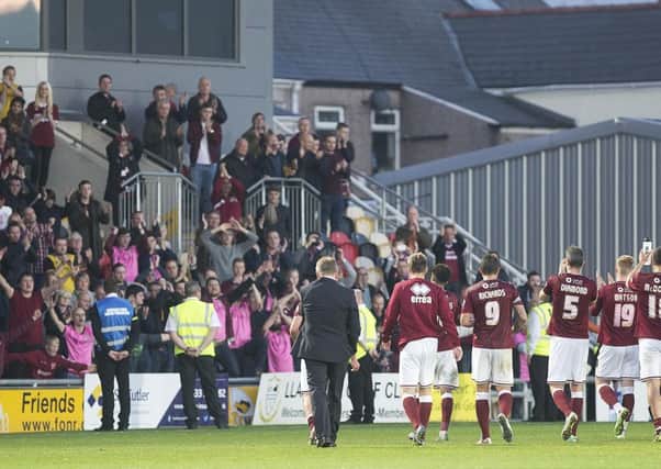 IN IT TOGETHER - the Cobblers players thank the travelling fans at the Newport match in October, 2015 (Picture: Kirsty Edmonds)