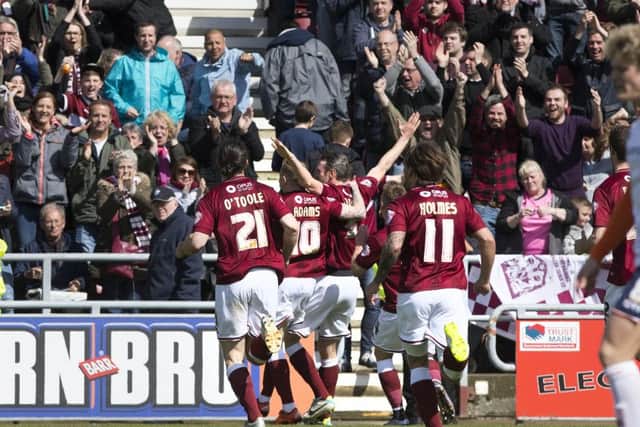 Zander Diamond celebratres scoring the opener in the 2-0 win over Luton Town in April, 2016. The day the Cobblers collected the Sky Bet League Two table (Picture: Kirsty Edmonds)