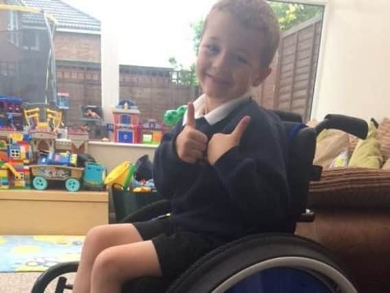 Max in his new wheelchair. Credit: Newlife.