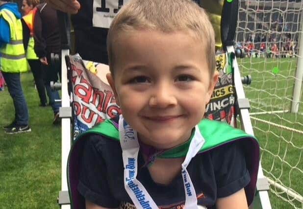 Max in his Newlife-funded buggy at a Superhero event.