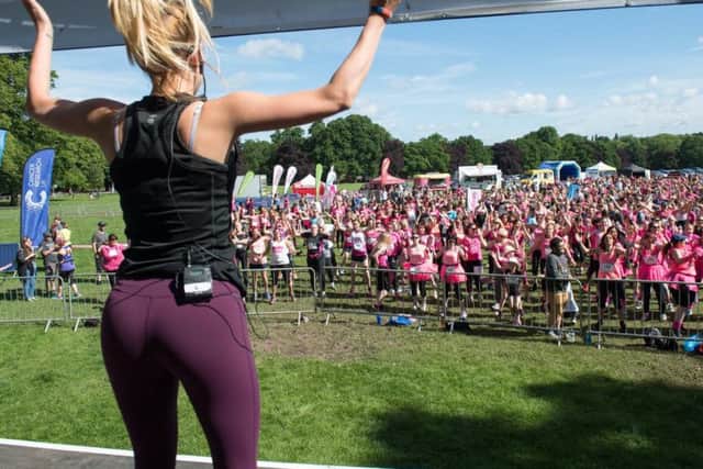The girls get motivated with a warm-up routine before the races.