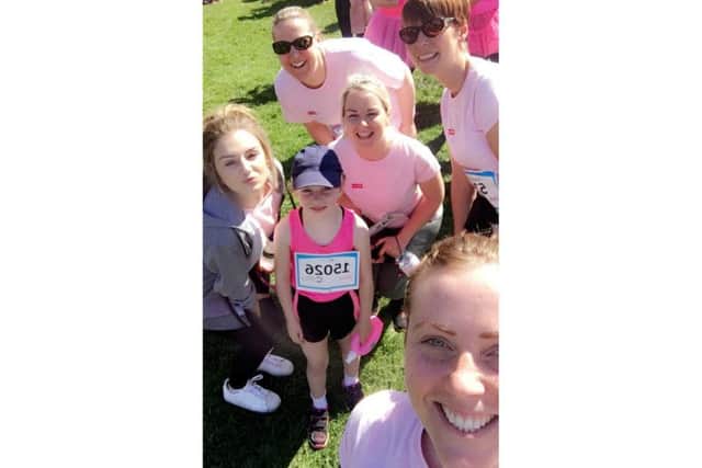 Katy stops for a selfie with her running mates.