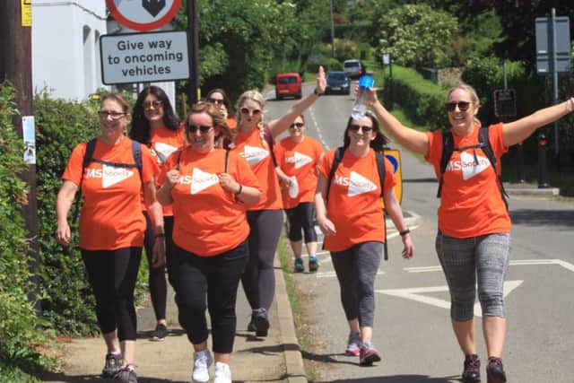 Zoe Chatley (arms raised) and friends reach The Plough Inn in Shutlanger