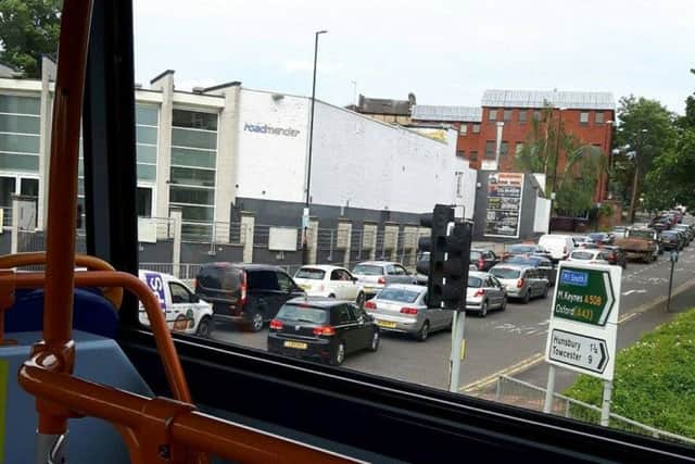 Cars and buses queue through gridlocked Northampton town centre.