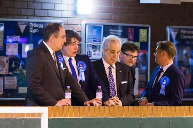 Michael Ellis and Conservative party representatives watch the count in Northampton