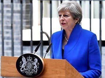 Theresa May outside Downing Street after this afternoon's visit to meet the Queen