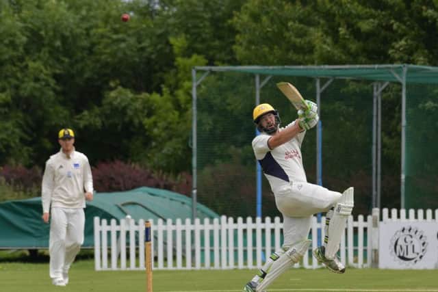 ON THE PULL - Brixworth's Fred Newborough hits out in his team's draw with Finedon Dolben (Pictures: Dave Ikin)