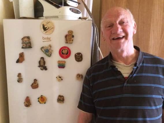 Tony Barrett with his new fridge, donated by an anonymous member of his community.