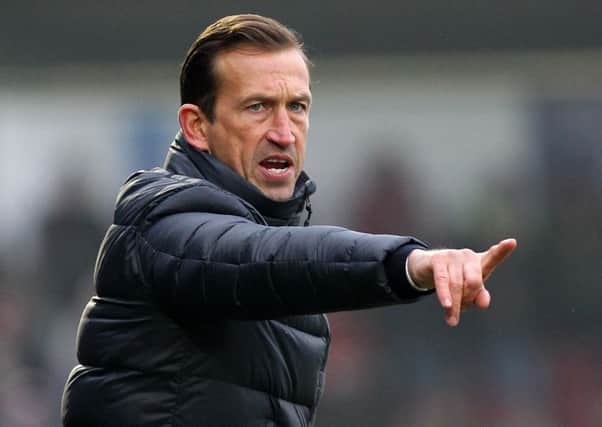 WORKING HARD TO COMPLETE SIGNINGS - Cobblers boss Justin Edinburgh