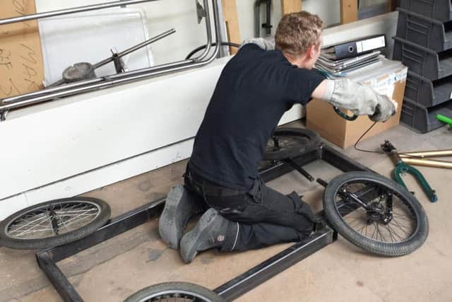 The team must build and test their own soapbox.