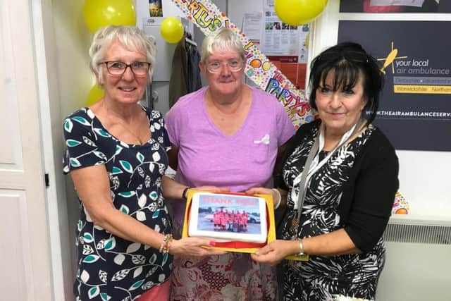 Ms Clifford (right) is pictured with volunteers Janice Lee and Shirley Steel (left).