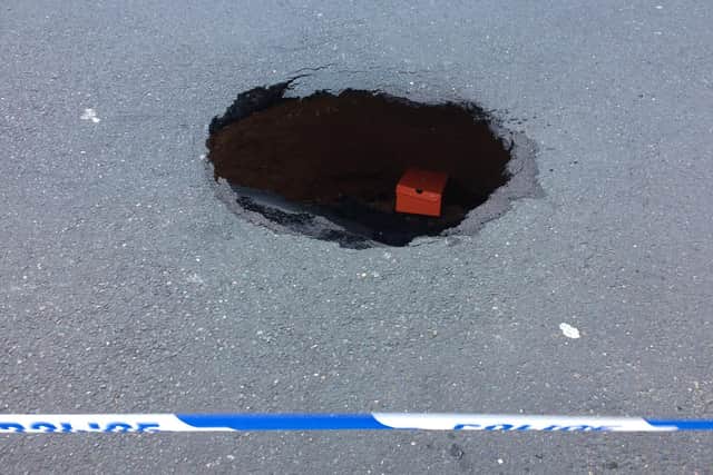 The hole in Overstone Road.