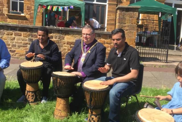 The Mayor of Northampton, councillor Gareth Eales, (Spencer, Lab) taking part in some African drumming.