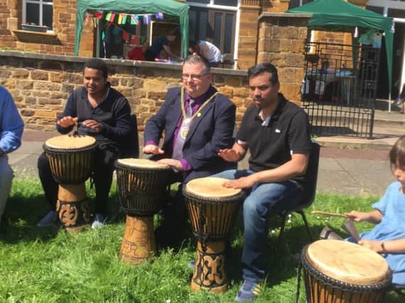 The Mayor of Northampton, councillor Gareth Eales, (Spencer, Lab) taking part in some African drumming.