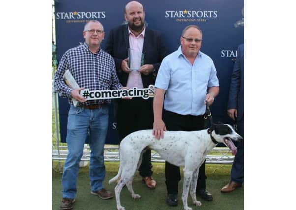 From left to right: Nick Livesey, greyhound operations director; Graham Holland, Clares Rocket trainer; Martin Chapman, Star Sports