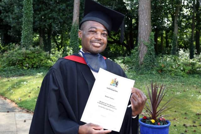 Dennis Newlove, 28, with his 2:1 degree certificate in Health Studies and Social Care.