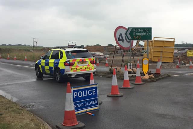 The A43 is closed after a four-vehicle crash between Moulton and Sywell.