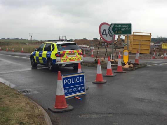 The A43 is closed after a four-vehicle crash between Moulton and Sywell.