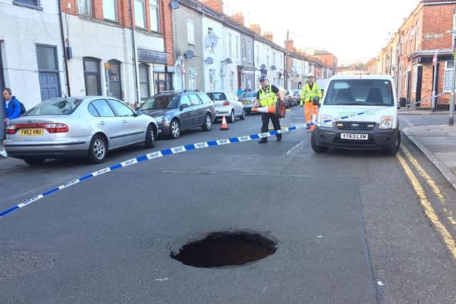 The sinkhole in Overstone Road opened up on Friday.