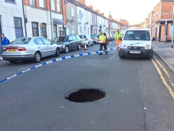 The sinkhole in Overstone Road opened up on Friday.