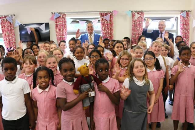 Michael Ellis and the 50-srong children's choir officially opening the refurbished facility.