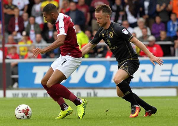 Dean Bowditch shadows Cobblers winger Kenji Gorre during the Sixfields clash between the Cobblers and Milton Keynes Dons in September, 2016