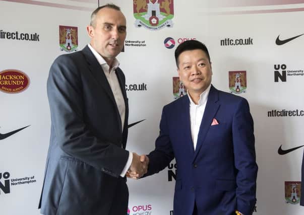 TEAMING UP - Cobblers chairman Kelvin Thomas (left) and 5USport CEO Tom Auyeung shake on their partnership at Monday's Sixfields press conference (Pictures: Kirsty Edmonds)
