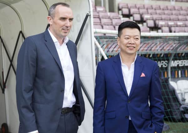 Cobblers chairman Kelvin Thomas (left) and 5USport CEO Tom Auyeung at Sixfields this week (Pictures: Kirsty Edmonds)