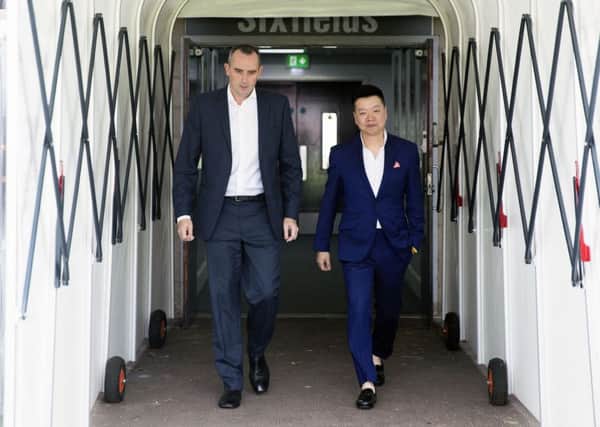 Cobblers chairman Kelvin Thomas (left) and 5USport's Tom Auyeung (Pictures Kirsty Edmonds)