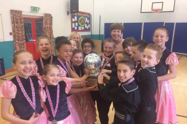 Overstone Primary School's winning team with their hard-earned trophy.