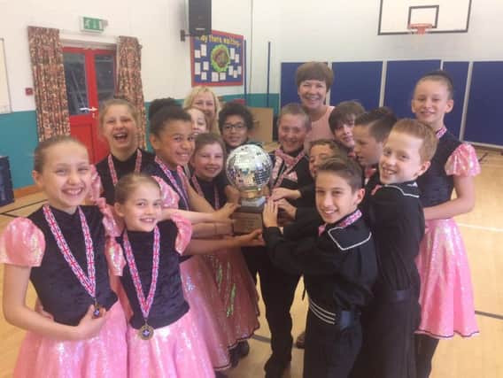 Overstone Primary School's winning team with their hard-earned trophy.