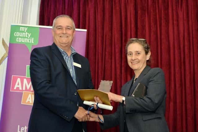 Nigel Anderson from Sponsor EBP presents the Secondary School of the Year to Northampton High School.