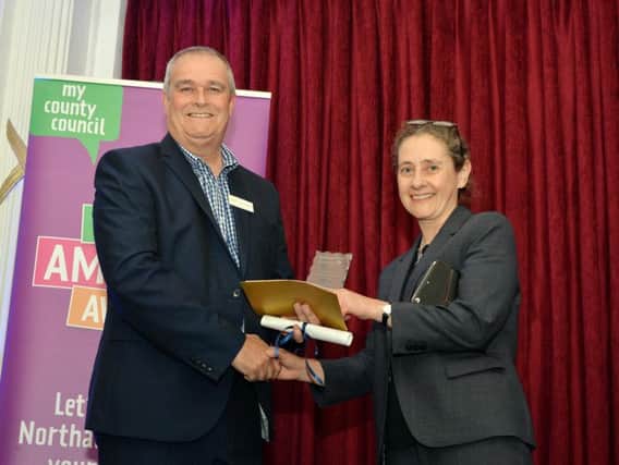 Nigel Anderson from Sponsor EBP presents the Secondary School of the Year to Northampton High School.